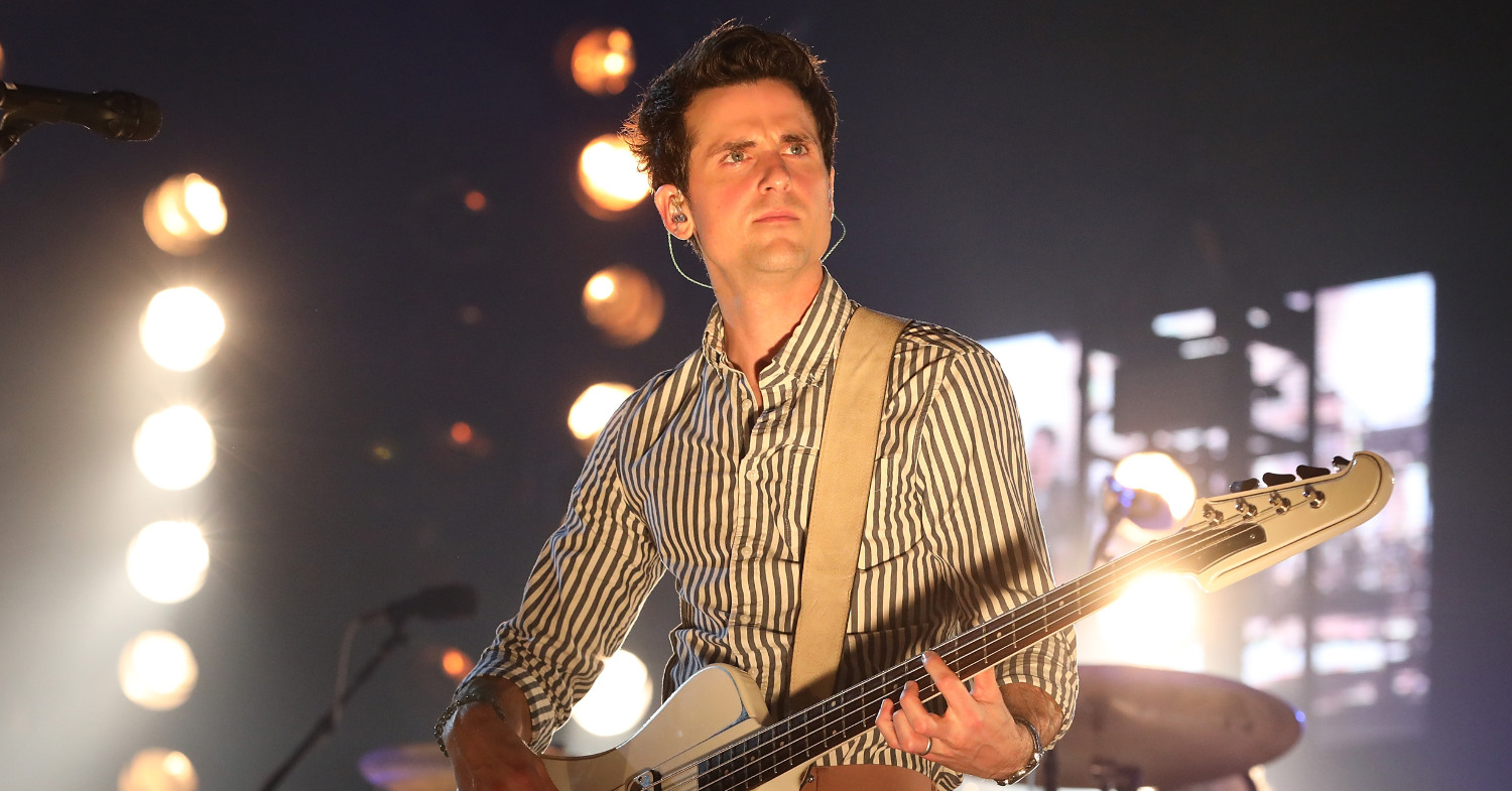 Photo of Kings of Leon's Jared Followill performing live. The bass player has been plant-based for over a year.