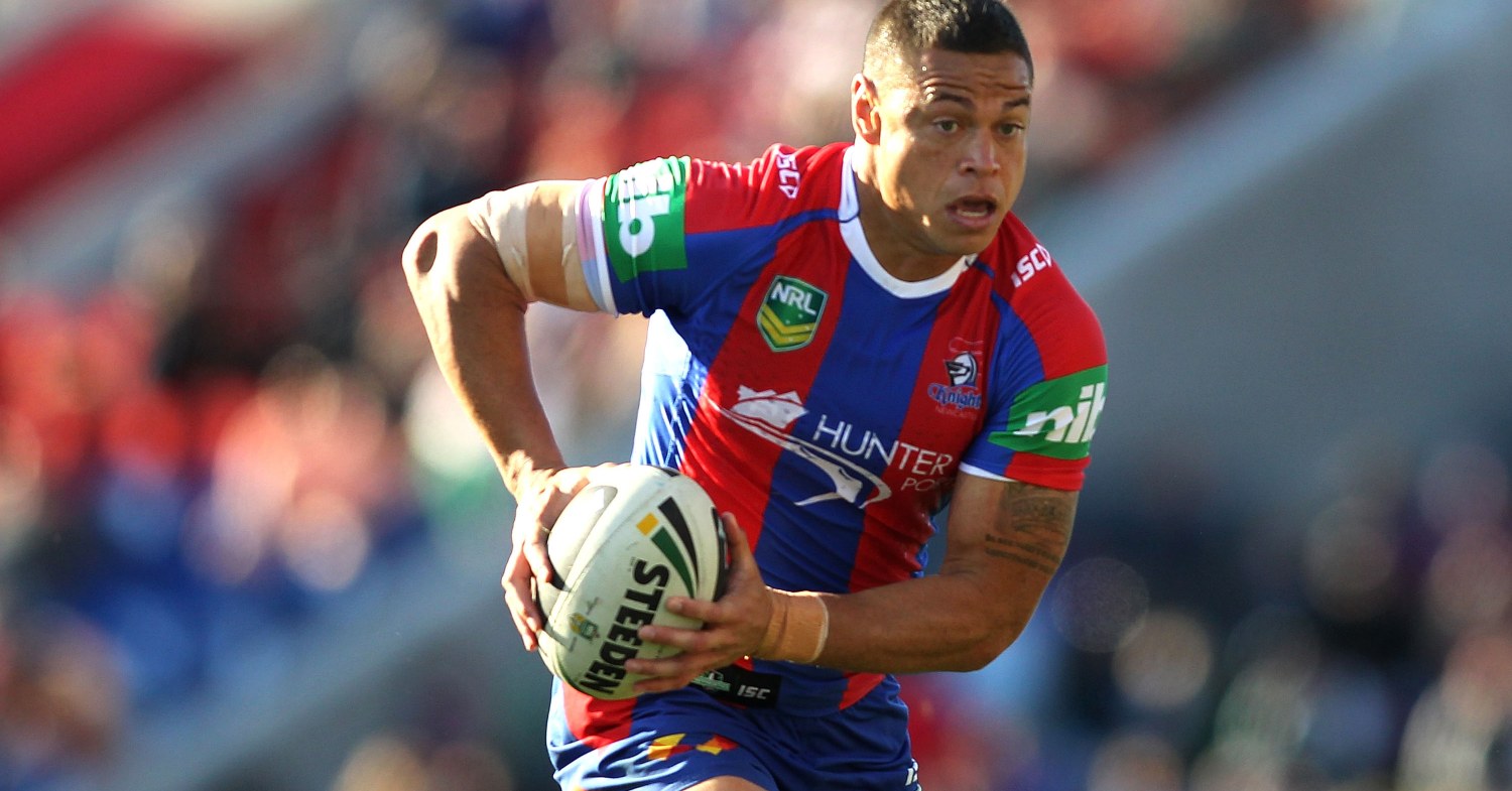 Timana Tahu runs with the ball during a game for the Newcastle Knights