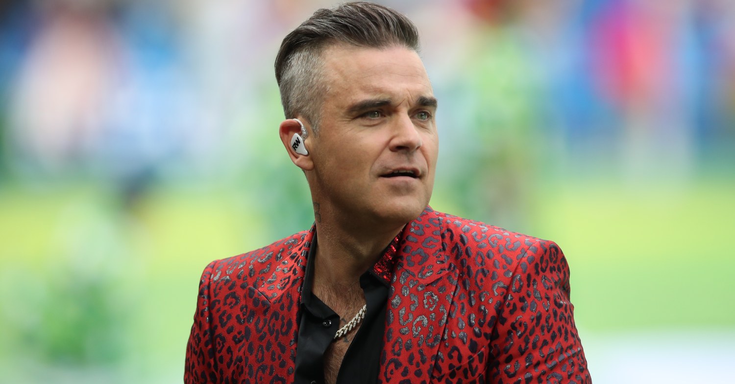 robbie williams in a red suit