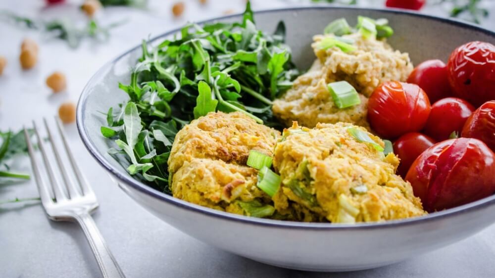 Vegan Chickpea Fritter Bowl With Spinach, Arugula, and Hummus