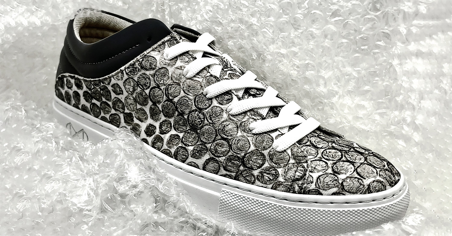 Vegan recycled bubble wrap sneakers from Nat-2 on a bubble wrap plastic background