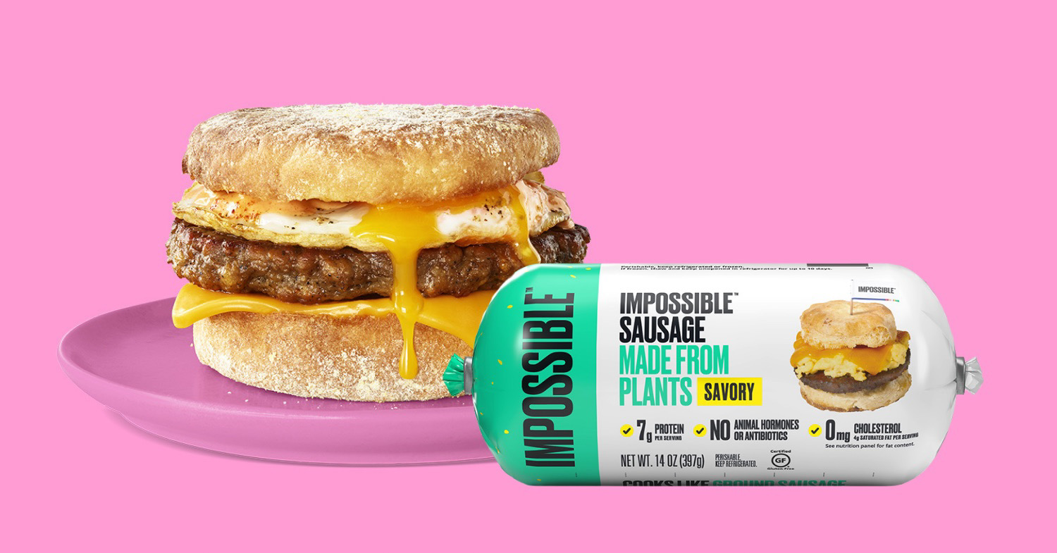 Image features an egg muffin made with Impossible Foods' vegan sausage alongside the external packaging, placed on a pink background.