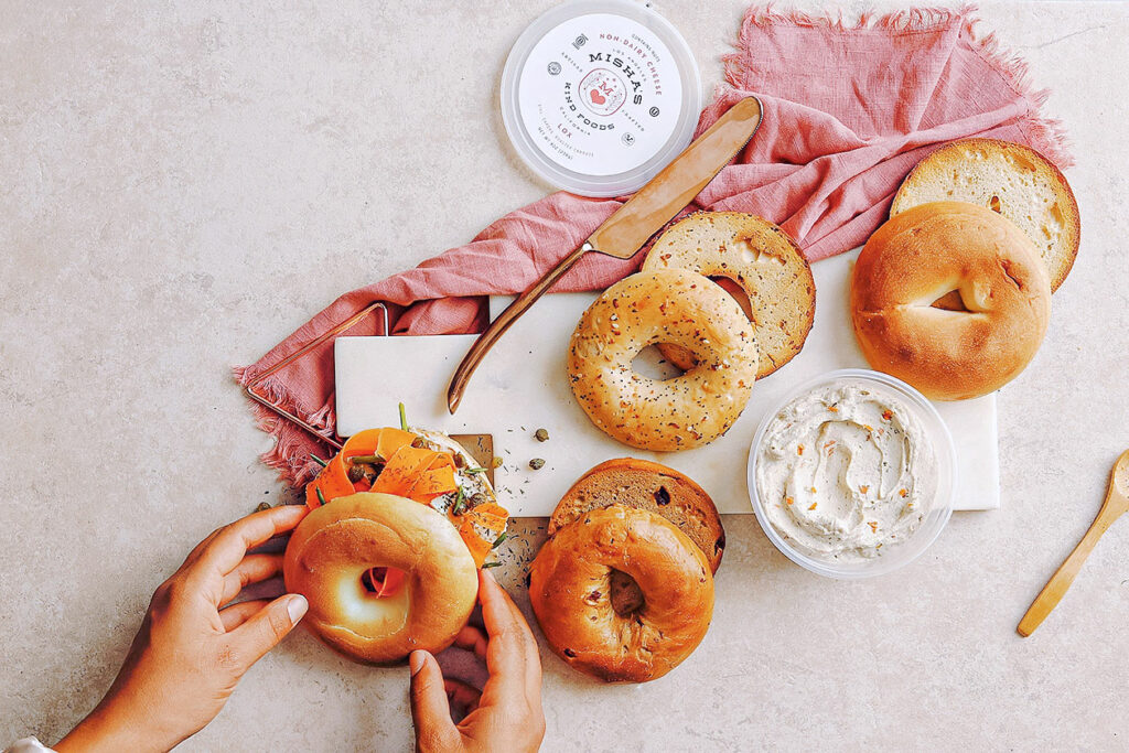 Photo shows a spread of bagels and vegan cheese from Misha's Kind Foods, one of Jay-Z's latest invesments.