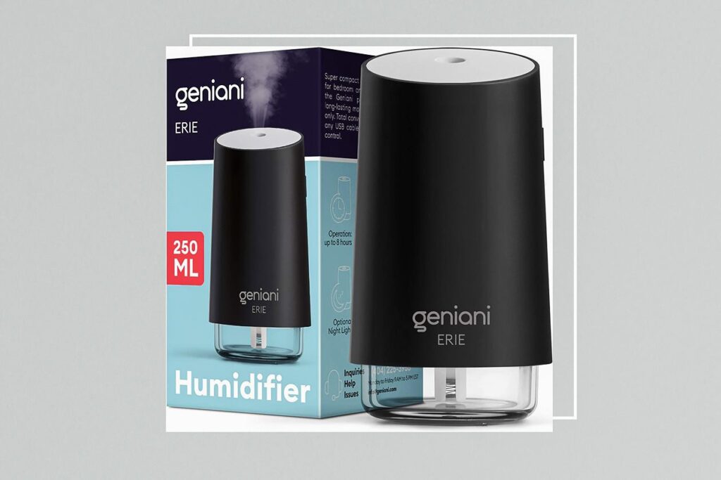 Photo shows a cylindrical humidifier with a clear bottom and matte black casing