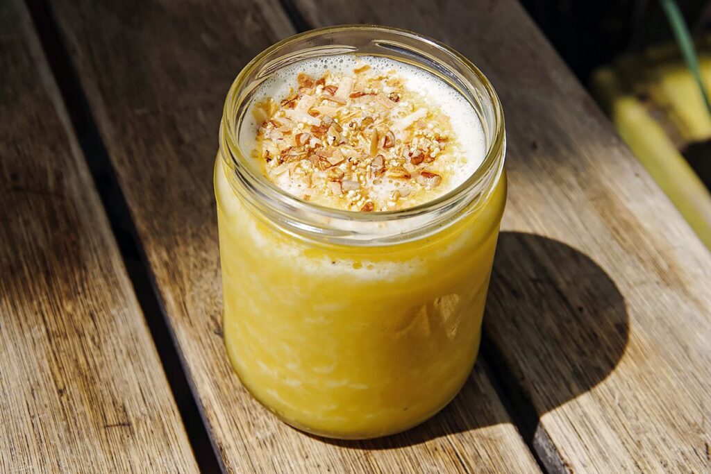 Photo shows a yellow smoothie made with amaranth