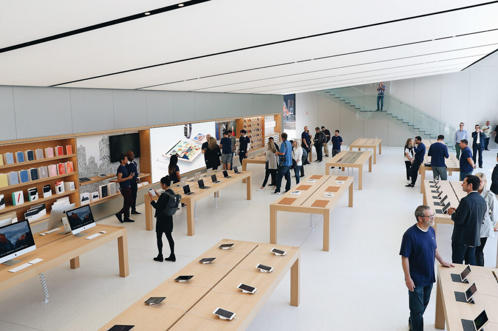 Photo shows the interior of an Apple store.