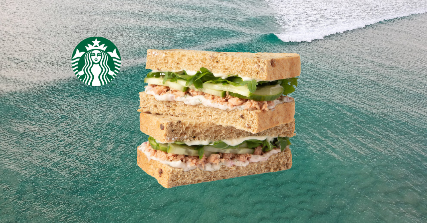 Photo shows the new vegan tuna fish sandwich on a seascape background next to the green Starbucks logo.