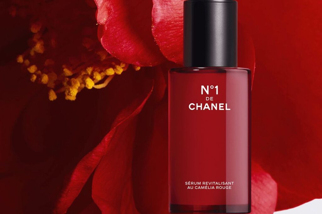 Chanel's new sustainable serum against a red camellia background