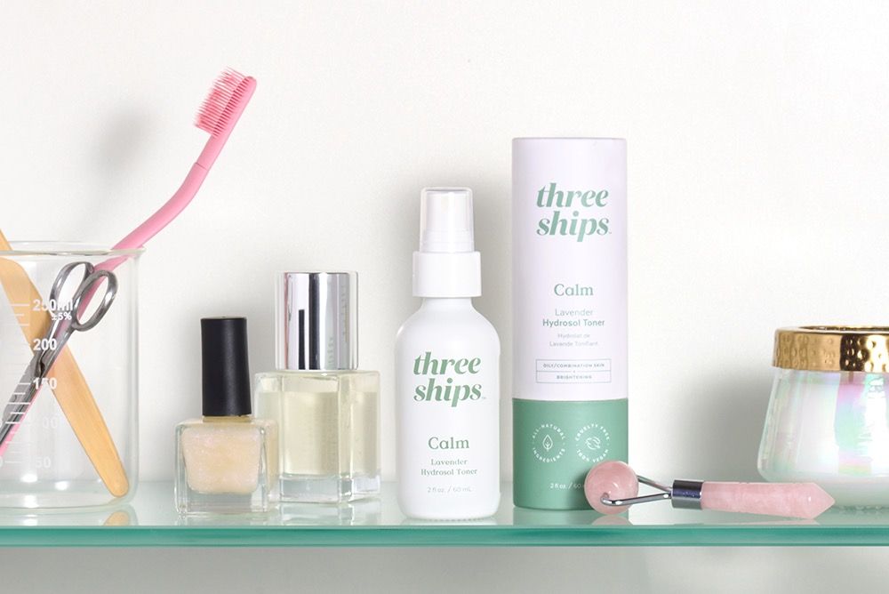 Three Ships Beauty products on a bathroom shelf